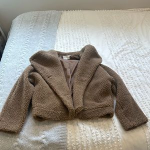 Lush teddy brown jacket. Elastic waist band in back. Buttons in front w/ pockets